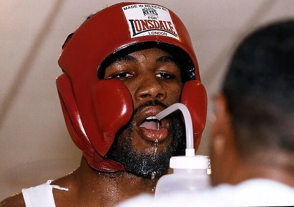 Lennox Lewis Boxing Heavyweight Boxer takes a drink durong a training session