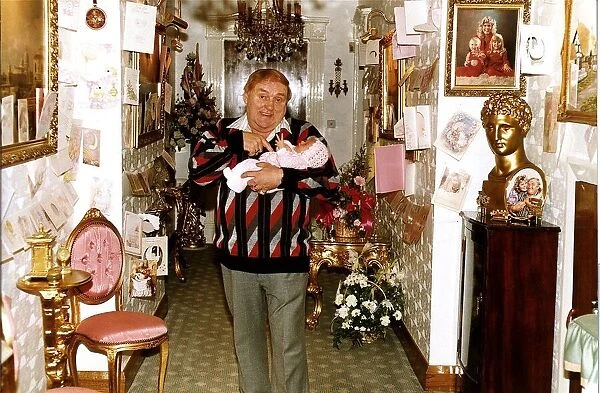 Les Dawson comedian with his baby daughter Charlotte at home A©Mirrorpix