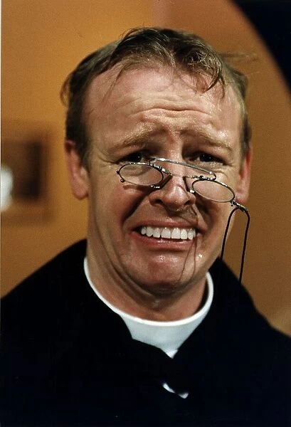 Les Dennis Comedian and TV presenter in one of his comedy roles as a vicar