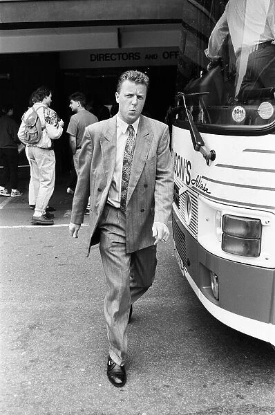 Liverpool football player Steve Nicol boards the team coach for their away match at