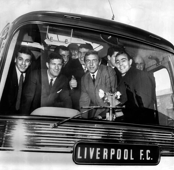 Liverpool football players, full of high spirits as they board coach for cup tie against