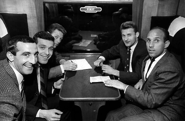 Liverpool football players sitting in first class as they wait for train to depart