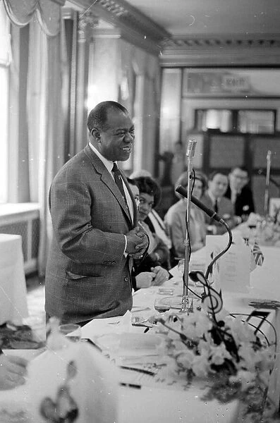 Louis Armstrong making a speech during the Daily Mirror lunch for him at the Cafe Royal