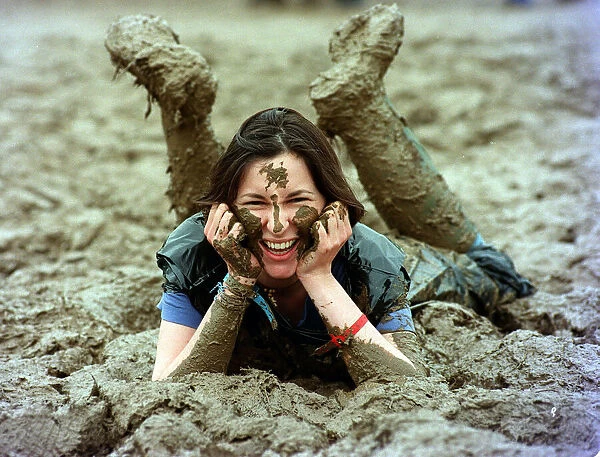 Lucy Rock enjoying the mud at Glastonbury festival June 1997