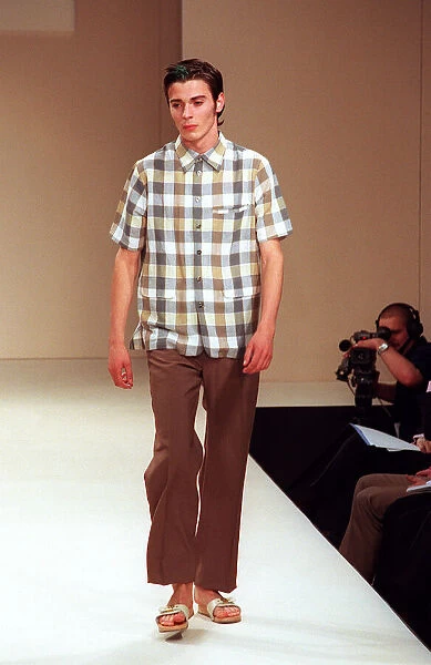 Male model on catwalk in Designworks show for mens 1998 fashion week wearing check