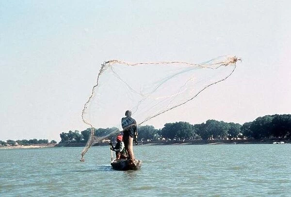 Mali Fisherman on the River Ropti casting their nets December 1993