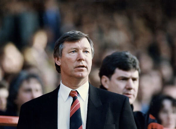 Manchester United manager Alex Ferguson with assistant Brian Kidd watching the action