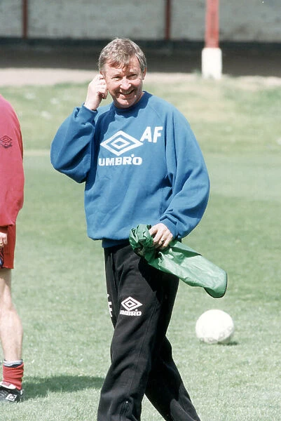Manchester United manager Alex Ferguson in relaxed mood during a team training session