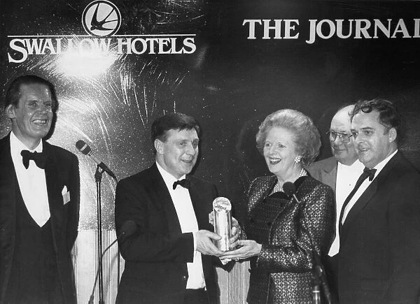 Margaret Thatcher presents the award to Mr Bernard Robinson, with Paul Nicholson, left