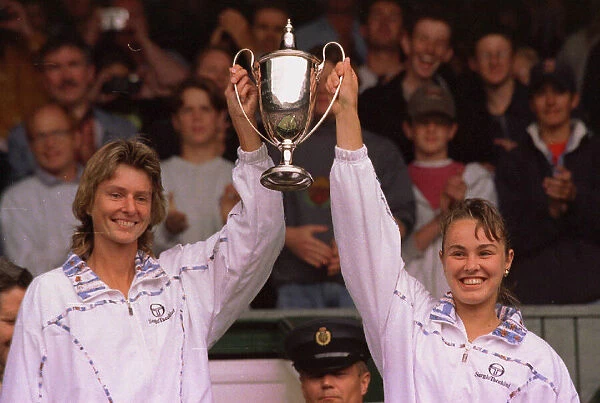 Martina Hingis and Helena Sukova celebrate winning the womens double final at Wimbledon