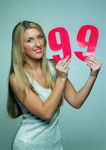 The Max Cover December 1998 Model Erin Gavin holding the number 99