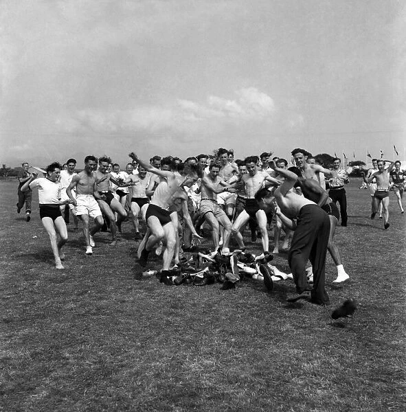 Men play hunt the shoes at a holiday camp Holiday scenes. August 1952 C4025