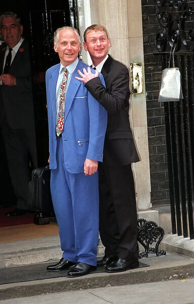 MIchael Cashman and friend John Cottingham July 1997 arrive for Downing Street party