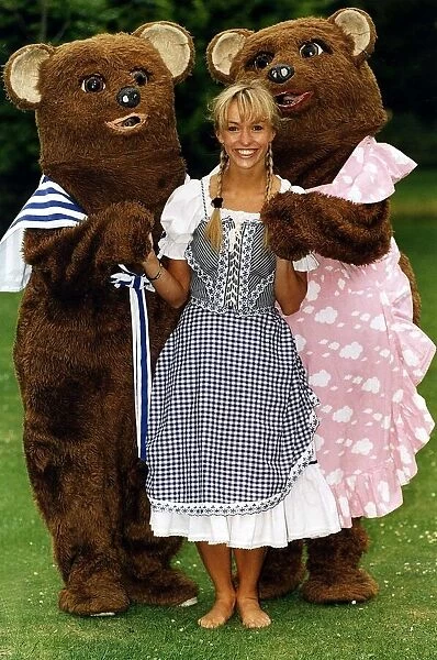 Michalea Strachan Tv Presenter Standing with two life size teddy bears