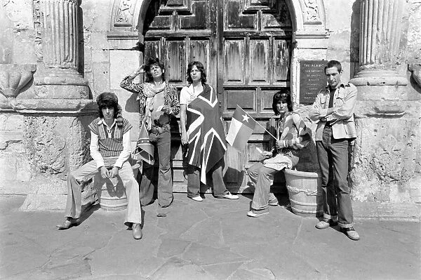 Mick Jagger (with Union Jack flag) and his Rolling Stones band stand at the famous Alamo