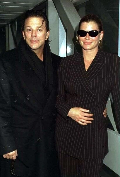 Mickey Rourke Actor arriving at Heathrow from Los Angeles with Carrie Otis Actress here