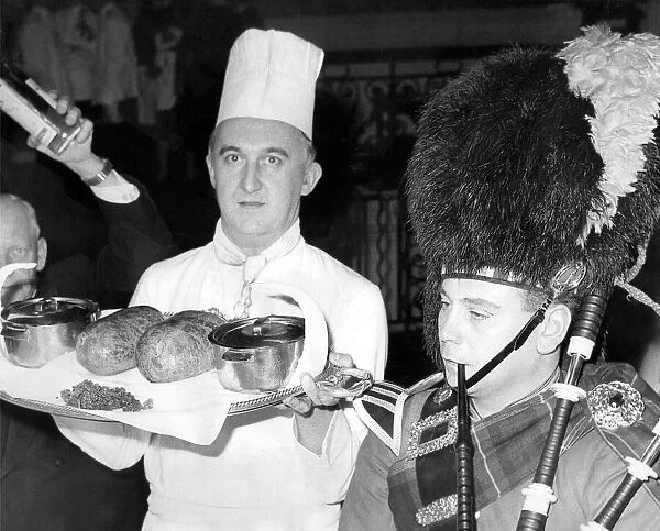 Mike Harper piping in the haggis perepared by the chef, Mr