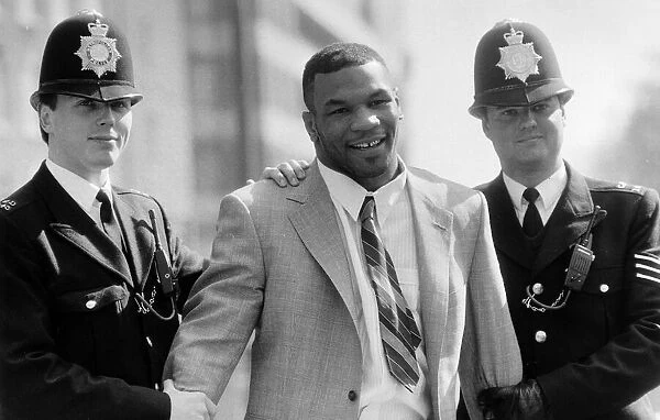 Mike Tyson being held by police March 1987