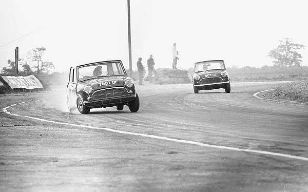 Two Mini Coopers seen here competing in the Daily Mirror Trophy event at Snetterton 29th
