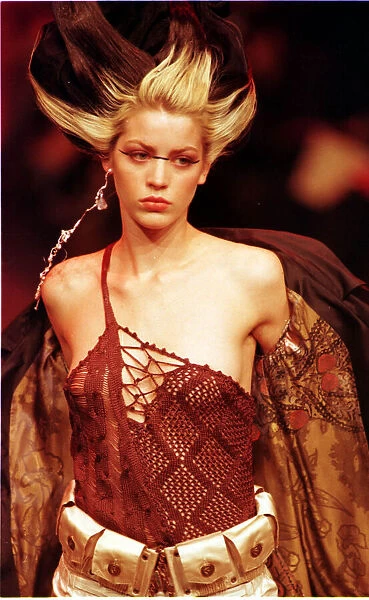 A model sports a red knitted top October 1997 designed by Christian Lacroix for