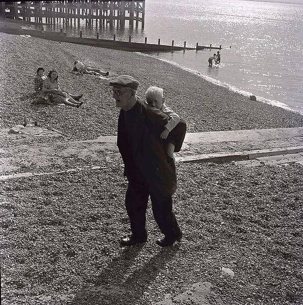 Mr G. A. B. Warner an Oyster fisherman from Whitstable in Kent takes his grandson for a