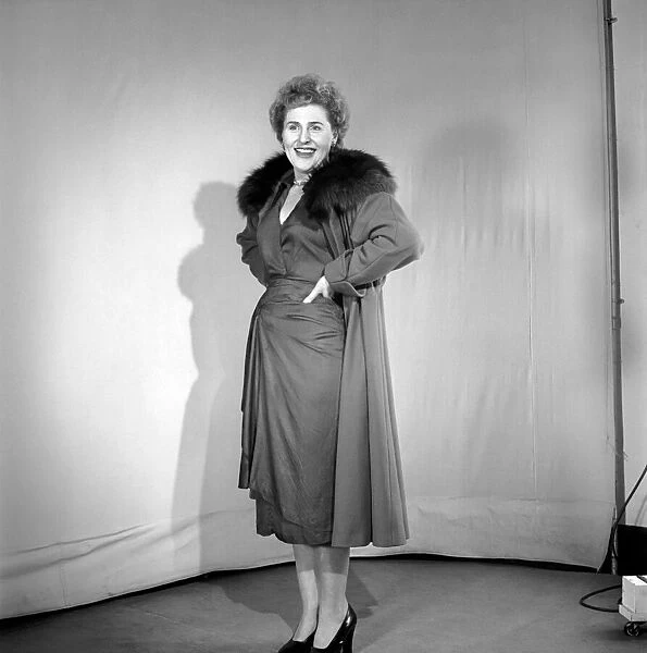 Mrs. Chapman models the latest fashions of 1953. January 1953 A28