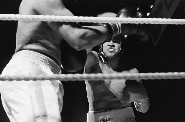 Muhammad Ali having fun with a spectator at boxing exhibition match in Birmingham