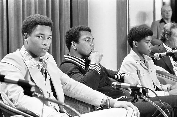 Muhammad Ali at a press conference with Phillip 'Chip'McAllister, left