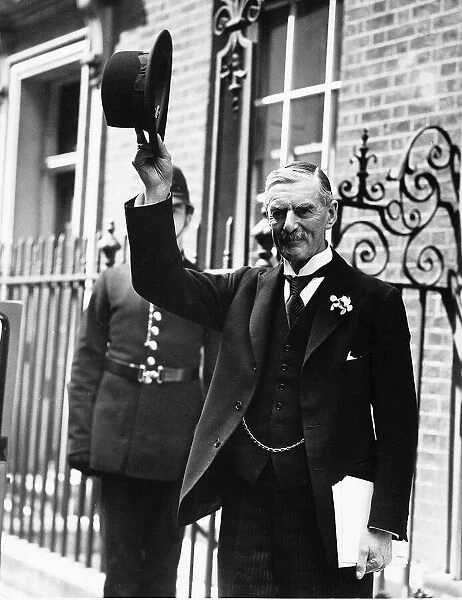 Neville Chamberlain acknowledges the crowd outside no 10 Downing st