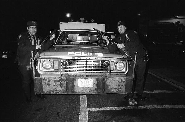 Two New York Policemen in front of their truck. 13th February 1981