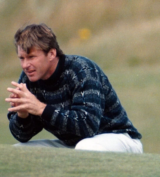 Nick Faldo at the British Open Golf Championship 1995, squats on the 16th green at St