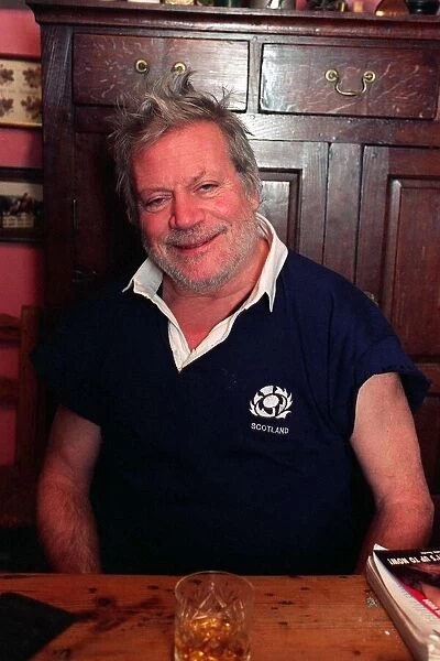 Oliver Reed actor wearing Scottish rugby shirt at home in County Cork Ireland