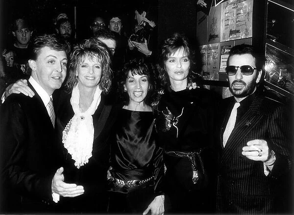 Olivia Harrison, wife of George, with former Beatle Paul McCartney and wife Linda