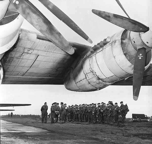 Paratroopers of the 3rd Battalion prepare to embark on an RAF Shackleton Aircraft at