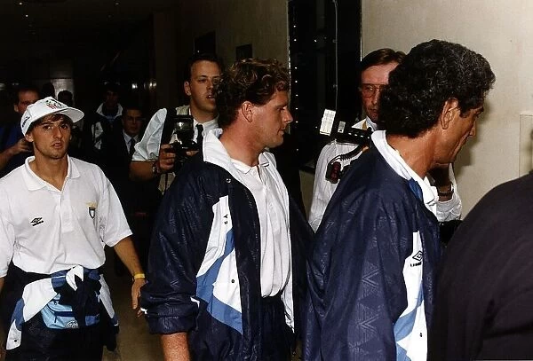 Paul Gascoigne surrounded by phpotographers and reporters after he walked silently out of