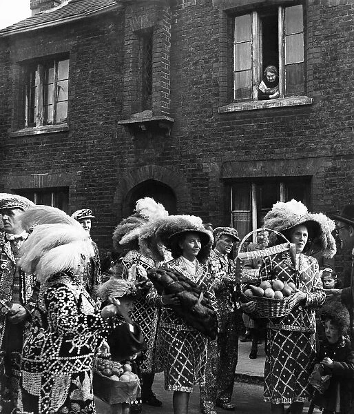 Pearly Kings and Queens arrive at St Marts Church Walworth with offerings for the '