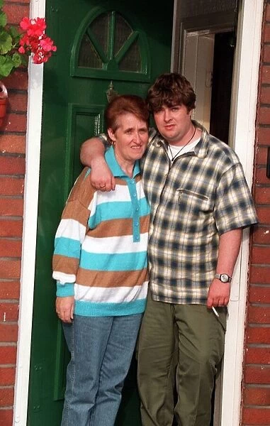 Peggy Gallagher Oasis mum is hugged by son Paul as they look sad after the reported break