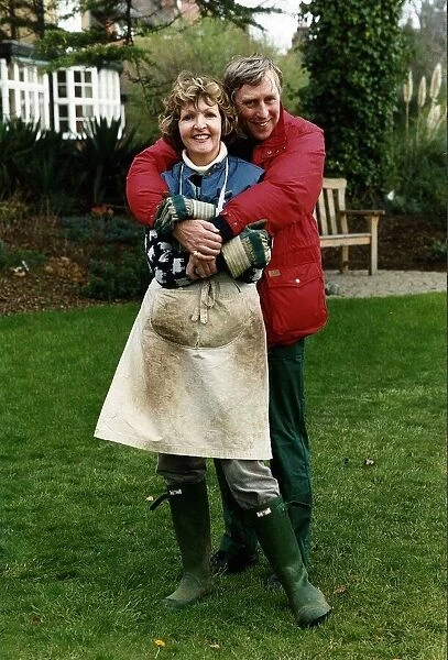Penelope Keith actress with husband in garden. April 1989