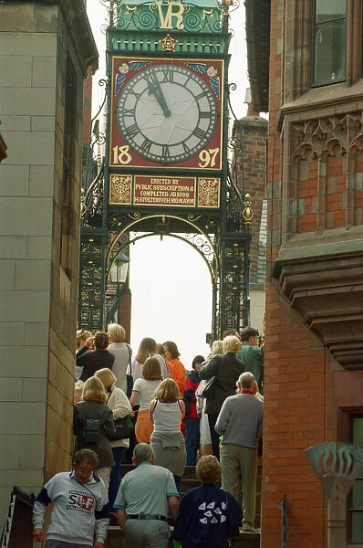 People watching the solar eclipse at the Eastgate and Eastgate Clock in Chester