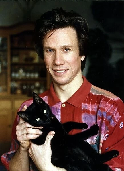 Peter Duncan TV Presenter holding cat