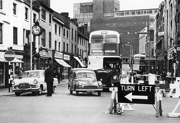 Police directing traffic coming down the Burges in Coventry city centre. 23rd July 1963