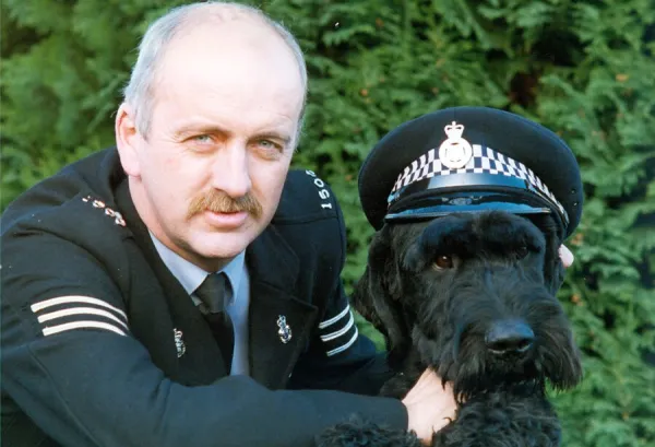 Police dog Kruger the Giant Schnauzer with his handler Paul Hedges