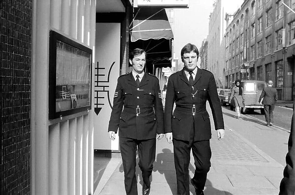 Policemen Ray Fullalove and Sgt. James Findlay on patrol. February 1975 75-01072