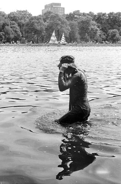 Pop fan swimming in the Serpentine at The Rolling Stones concert at Hyde Park