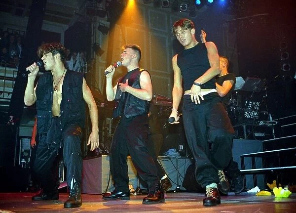Pop group take That performing live on stage at a concert November 1992