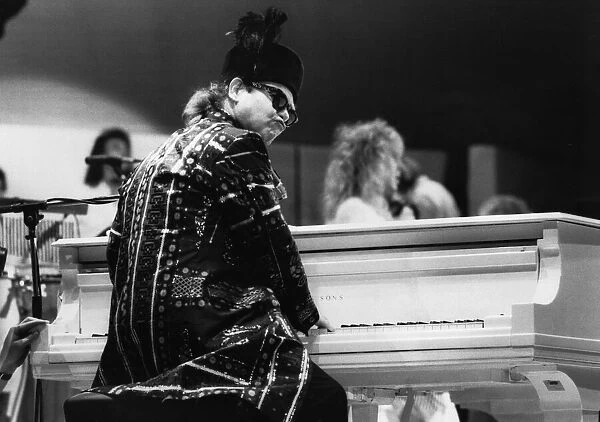Pop star Elton John at the piano as he performs at the Live Aid concert held at Wembley