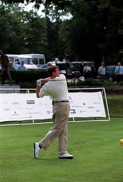 Prince Andrew in July 1998 Hitting golf ball at a golf tournament