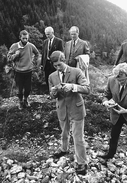 Prince Charles hikes over wild Welsh countryside to an old mine which provided gold for