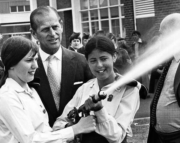 Prince Philip visiting Wales. The Duke of Edinburgh chats to Eira Morris aged 17 (left