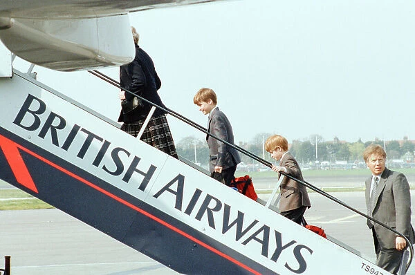 Prince William and Prince Harry board aircraft at London Heathrow Airport